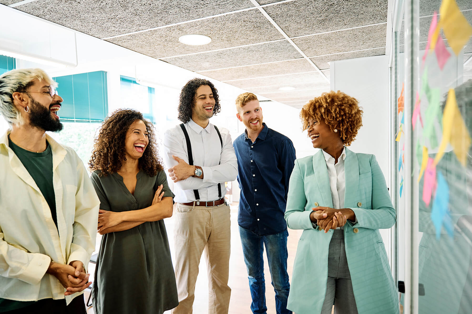 HR executive standing and providing sexual harassment in the workplace training to a room of young employees.