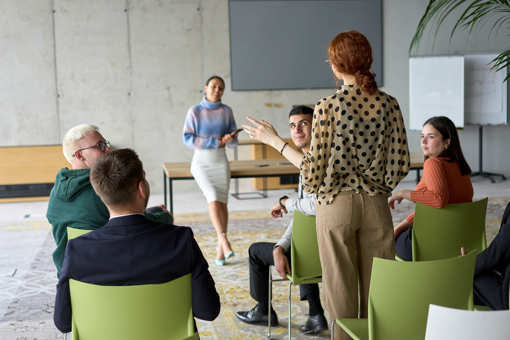 Female employee stands up and speaks out during workplace POSH Training